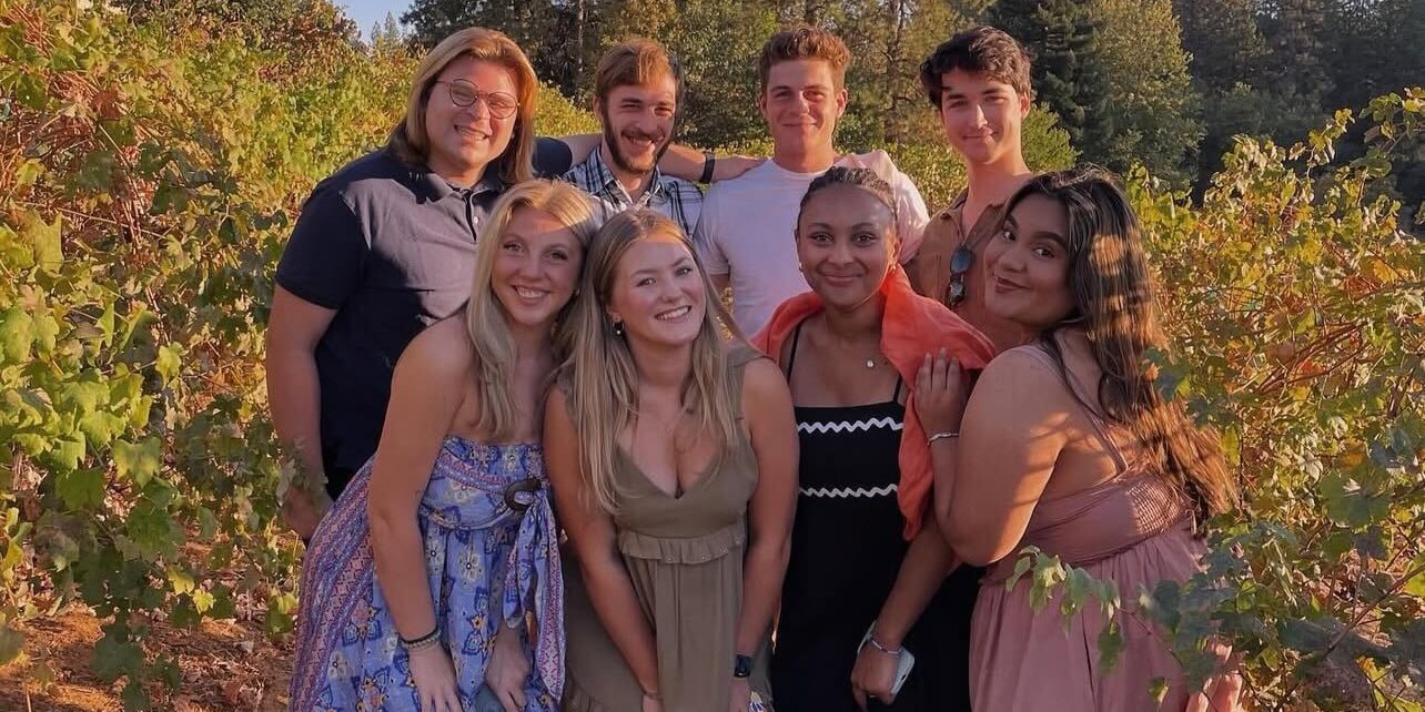 Students posing for a photo in dress attire